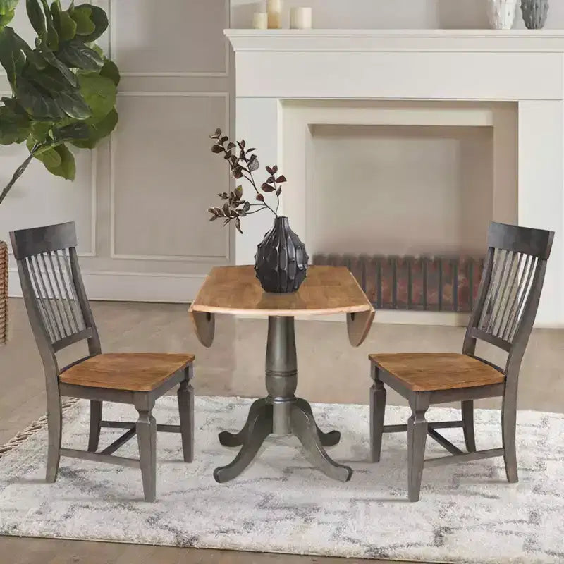 Set da 3 Pezzi Tavolo da Pranzo Rotondo da 42" con Doppia Prolunga a Goccia e 2 Sedie con Schienale a Sbarre Noce Americano/Carbone Lavato - International Concepts: Set Compatto in Parawood